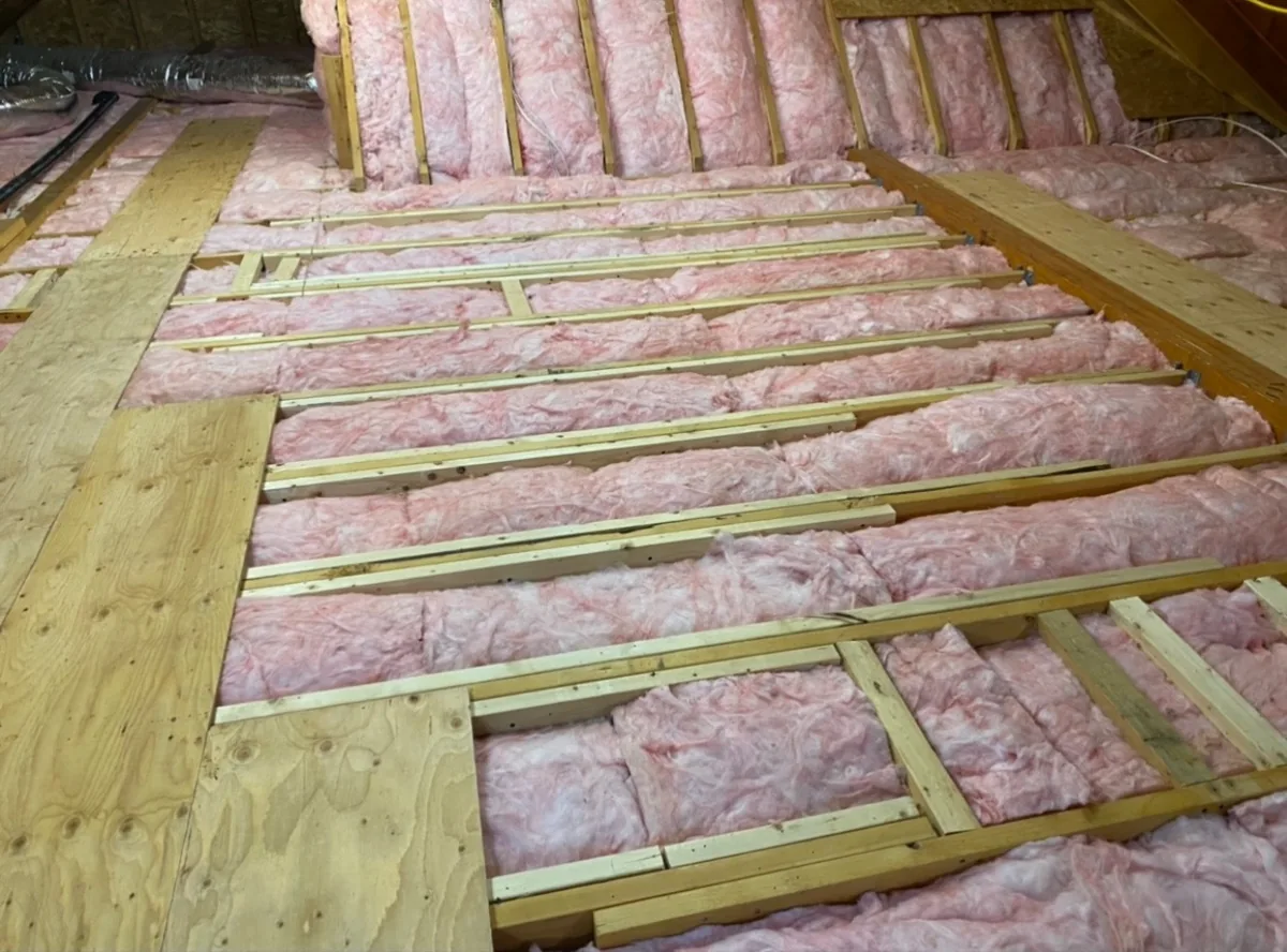 Attic with fresh insulation and a new plywood walkway