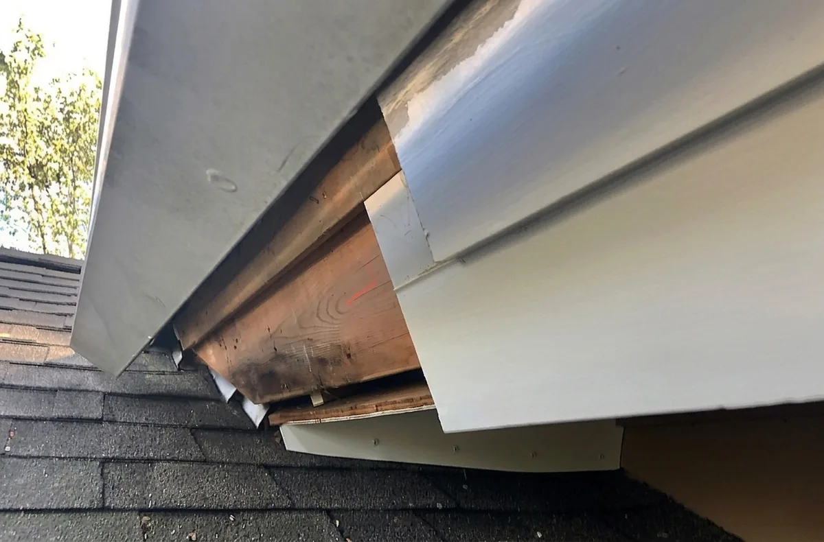 Soffit flashing torn open by wildlife