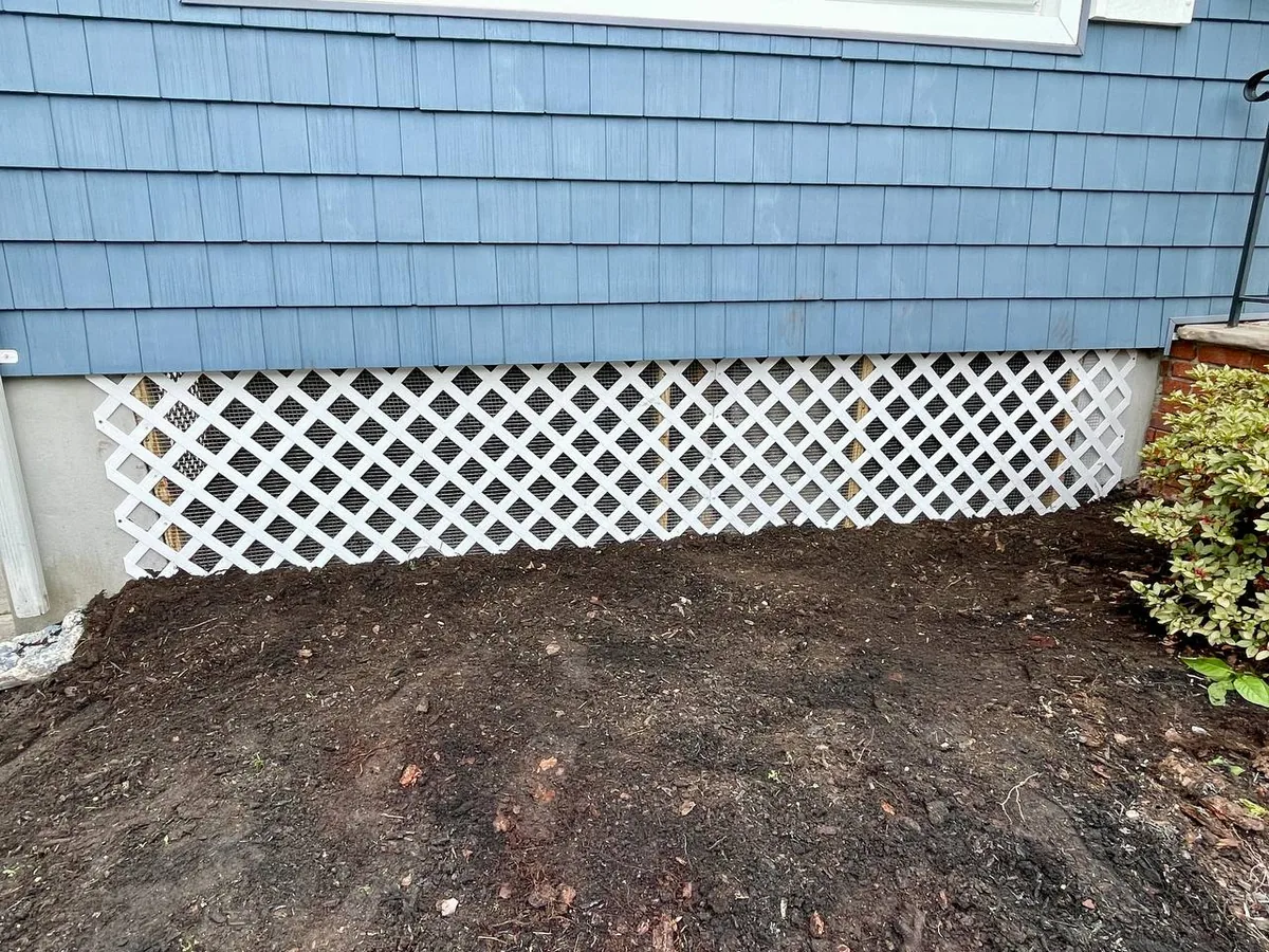 Finished under-home barrier faced with original lattice to match the house